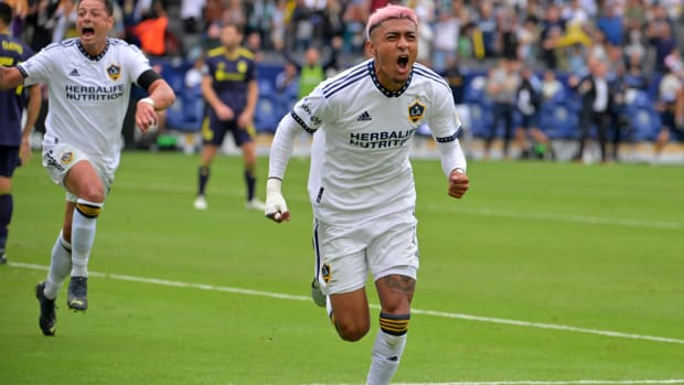 Galaxy defender Julian Araujo celebrates after scoring a goal.